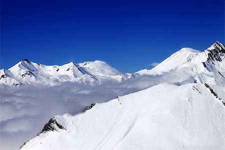 simsearch:400-08530488,k - Mountains in clouds at nice nice day. Caucasus Mountains, Georgia, Gudauri. View from ski slope. Stock Photo - Budget Royalty-Free & Subscription, Code: 400-07428953