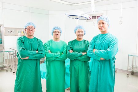 professional surgeon teams standing in a surgical room Stock Photo - Budget Royalty-Free & Subscription, Code: 400-07429094