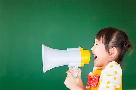 happy kid shouts something into the megaphone Stock Photo - Budget Royalty-Free & Subscription, Code: 400-07429168
