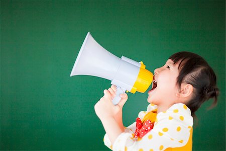 happy child  using a megaphone with blackboard Stock Photo - Budget Royalty-Free & Subscription, Code: 400-07429169
