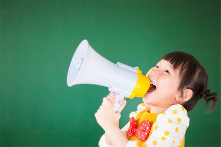 cute child  using a megaphone in a classroom Stock Photo - Budget Royalty-Free & Subscription, Code: 400-07429170