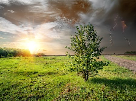 Lightning over a country road in the field Stock Photo - Budget Royalty-Free & Subscription, Code: 400-07429840