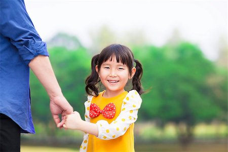 simsearch:400-07715953,k - cute girl hold father hand in the park Stock Photo - Budget Royalty-Free & Subscription, Code: 400-07429873