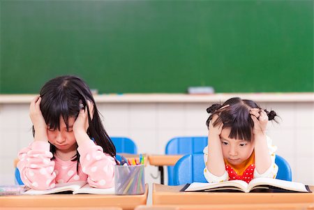 simsearch:400-04890006,k - two sad girls doing in homework Stock Photo - Budget Royalty-Free & Subscription, Code: 400-07429886