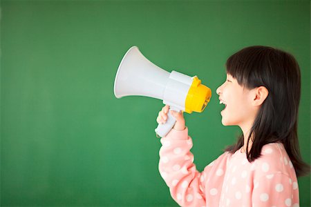 happy kid using a megaphone to shout Stock Photo - Budget Royalty-Free & Subscription, Code: 400-07429894