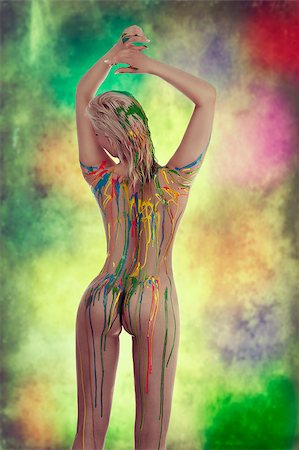 very sensual naked girl with multicolored body paint over her body giving sexy pose against white background. Foto de stock - Super Valor sin royalties y Suscripción, Código: 400-07429915