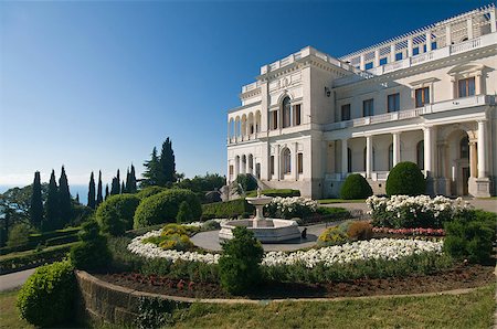 Livadia Palace was a summer retreat of the last Russian tsar, Nicholas II, and his family in Livadiya, Crimea. Livadia Palace is situated against the blue sky background. Stockbilder - Microstock & Abonnement, Bildnummer: 400-07429983