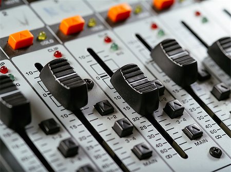 simsearch:694-03694097,k - Macro photo of faders of a studio soundboard. Foto de stock - Royalty-Free Super Valor e Assinatura, Número: 400-07420306