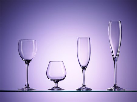 four empty wine glasses over purple background Stock Photo - Budget Royalty-Free & Subscription, Code: 400-07420552