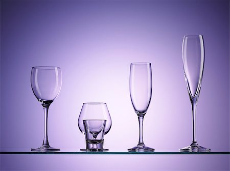 five empty wine glasses over purple background Stock Photo - Budget Royalty-Free & Subscription, Code: 400-07420553