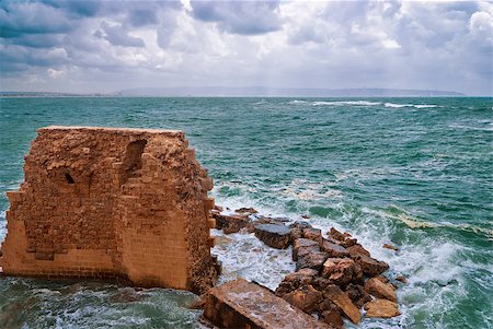 ship in stormy sea - Remains of fortress walls of the Acre and the Mediterranean Sea Stock Photo - Budget Royalty-Free & Subscription, Code: 400-07420752