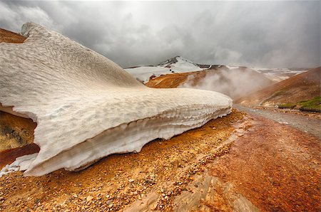 simsearch:400-07678701,k - Iceland is a land of ice and fire. In the geothermal area Kerlingarfjoll one can see smoke and boiling fumaroles from the geothermal field as well as mountains covered by ice and snow. Stock Photo - Budget Royalty-Free & Subscription, Code: 400-07421215