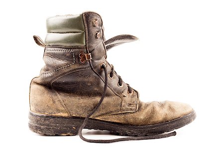 simsearch:400-07219073,k - old soldier's boots worn with scratches and untied shoelaces on white background Photographie de stock - Aubaine LD & Abonnement, Code: 400-07421433