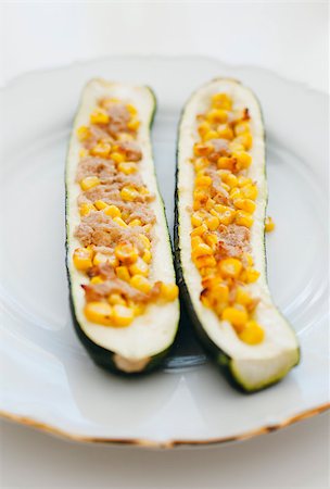 Zucchini stuffed with tuna fish and corn - tilt-shift lens used to accent the center of the dish and to emphasize the attention on it Stock Photo - Budget Royalty-Free & Subscription, Code: 400-07421444