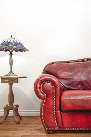 empty old living room - Luxurious Red Leather Couch and Lamp Details in front of a blank wall to ad your text, logo, images, etc. Stock Photo - Budget Royalty-Free & Subscription, Code: 400-07421738