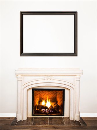 Luxurious White Marble Fireplace and empty wood frame for your text, logo, images, etc Stock Photo - Budget Royalty-Free & Subscription, Code: 400-07421772