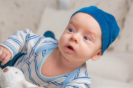 rolling over - 3 months old baby boy portrait at home trying to roll over. Stock Photo - Budget Royalty-Free & Subscription, Code: 400-07421869