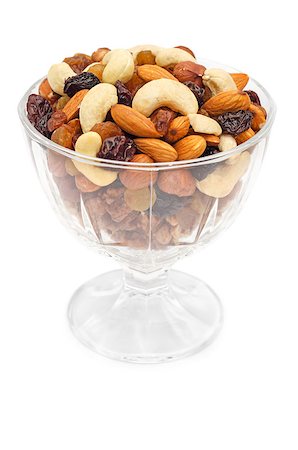 Mixed nuts and dry fruits in glass bowl isolated over white background Stock Photo - Budget Royalty-Free & Subscription, Code: 400-07422397