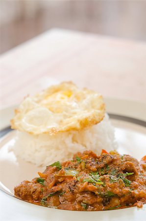 fried egg and pepper - close up pork fried with chili pepper and curry sauce and  fried egg over rice on plate Stock Photo - Budget Royalty-Free & Subscription, Code: 400-07422597