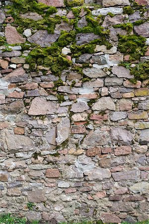 Old stone wall with different size of rock and moss Foto de stock - Super Valor sin royalties y Suscripción, Código: 400-07422837