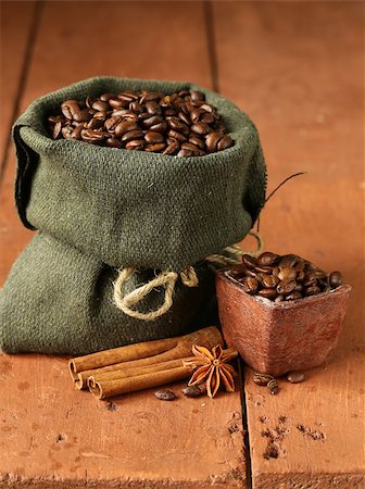 Still life of coffee beans in canvas sack on vintage wooden background Stock Photo - Budget Royalty-Free & Subscription, Code: 400-07423001