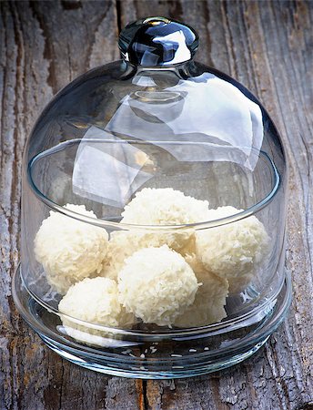 simsearch:400-07420117,k - Glass Jar with Delicious Coconut Candies closeup on Rustic Wooden background Stock Photo - Budget Royalty-Free & Subscription, Code: 400-07423340