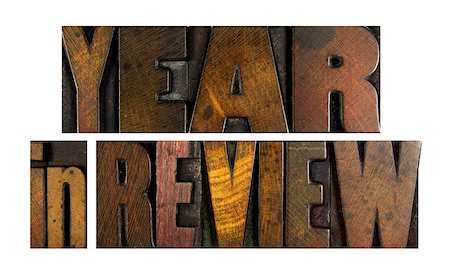 simsearch:400-07423443,k - The words YEAR IN REVIEW written in vintage letterpress type Fotografie stock - Microstock e Abbonamento, Codice: 400-07423474