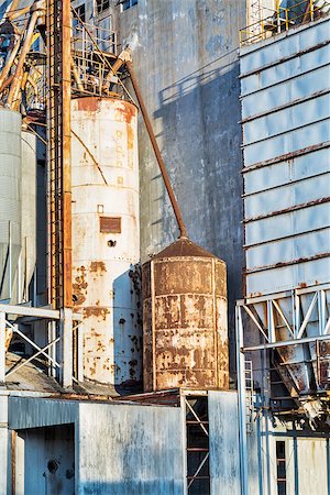 simsearch:400-07429824,k - industrial background - exterior of old abandoned grain elevator with pipes, ducts, ladders and chutes Stock Photo - Budget Royalty-Free & Subscription, Code: 400-07430041