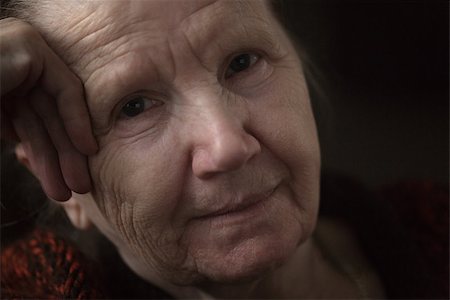 senior dark background - old woman thinking in the dark, close up Stock Photo - Budget Royalty-Free & Subscription, Code: 400-07430244