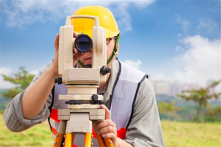 simsearch:400-04710606,k - Surveyor engineer making measure in outdoor Stock Photo - Budget Royalty-Free & Subscription, Code: 400-07431012