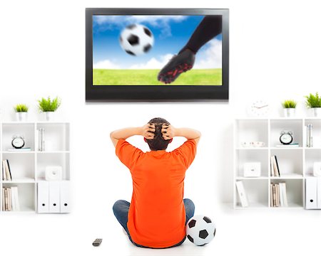 person yelling at tv - fan watching soccer game and feeling nervous Stock Photo - Budget Royalty-Free & Subscription, Code: 400-07431079