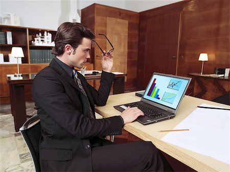 simsearch:400-04124882,k - Portrait of businessman with laptop in office Stock Photo - Budget Royalty-Free & Subscription, Code: 400-07445167