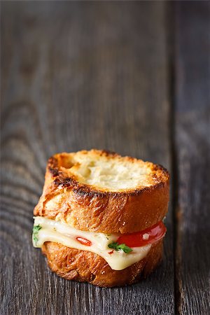 sandwich rustic table - Grilled cheese sandwich panini on a wooden board close-up. Stock Photo - Budget Royalty-Free & Subscription, Code: 400-07445532