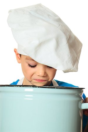 simsearch:400-06078465,k - Six years old cook boy is looking into the pan isolated on white Stock Photo - Budget Royalty-Free & Subscription, Code: 400-07445864