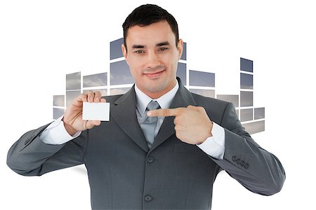 Businessman pointing at his businesscard against structure showing sky Stock Photo - Budget Royalty-Free & Subscription, Code: 400-07446756