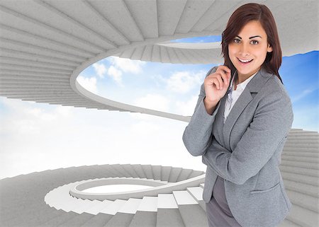 person on winding stairs - Smiling thoughtful businesswoman against spiral staircase in the sky Stock Photo - Budget Royalty-Free & Subscription, Code: 400-07446898