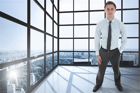 simsearch:400-07446676,k - Serious businessman standing with hand in pocket against room with large windows showing city Foto de stock - Super Valor sin royalties y Suscripción, Código: 400-07446907