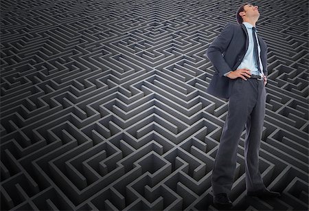 simsearch:400-07446676,k - Happy businessman with hands on hips against difficult maze puzzle Foto de stock - Super Valor sin royalties y Suscripción, Código: 400-07447035