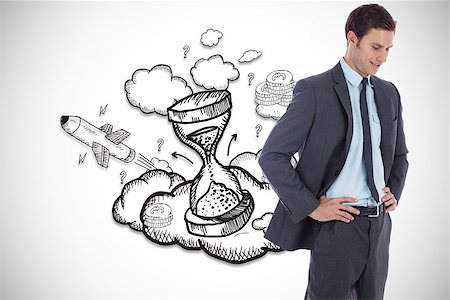 Smiling businessman with hands on hips against hourglass illustration Stock Photo - Budget Royalty-Free & Subscription, Code: 400-07447037