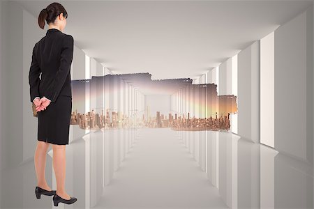 simsearch:400-07447273,k - Businesswoman standing against abstract screen in room showing cityscape Stock Photo - Budget Royalty-Free & Subscription, Code: 400-07447105