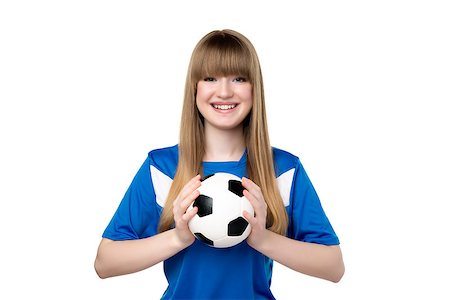 person playing soccer standing back - Girl in blue shirt is holding football isolated on white background Stock Photo - Budget Royalty-Free & Subscription, Code: 400-07447248