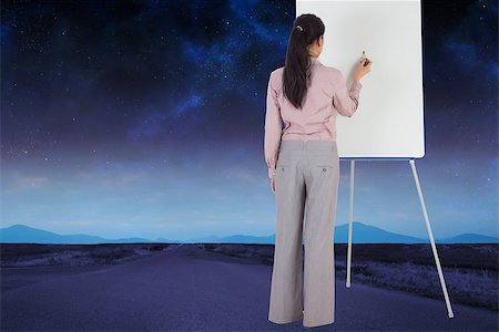 simsearch:400-07446838,k - Businesswoman painting on an easel against road leading out to the horizon Photographie de stock - Aubaine LD & Abonnement, Code: 400-07447659