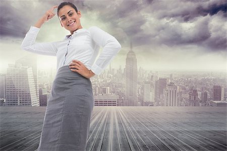 Smiling thoughtful businesswoman against balcony overlooking city Stock Photo - Budget Royalty-Free & Subscription, Code: 400-07447661