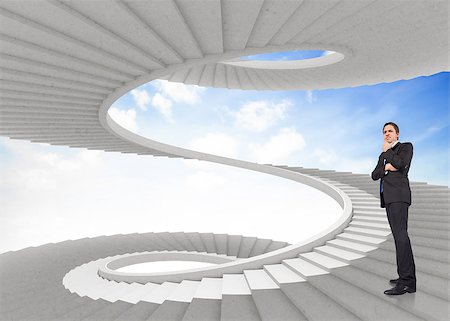 person on winding stairs - Thinking businessman touching chin against spiral staircase in the sky Stock Photo - Budget Royalty-Free & Subscription, Code: 400-07447960