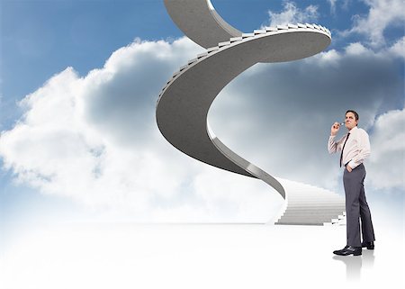 person on winding stairs - Thinking businessman holding glasses against spiral staircase in the sky Stock Photo - Budget Royalty-Free & Subscription, Code: 400-07447961