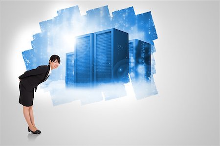 simsearch:400-07447273,k - Smiling businesswoman bending against display on wall showing server tower Stock Photo - Budget Royalty-Free & Subscription, Code: 400-07448082