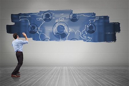 simsearch:400-07344883,k - Businessman posing with arms up against display on wall showing technology interface Stock Photo - Budget Royalty-Free & Subscription, Code: 400-07448106