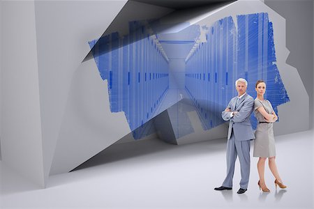 simsearch:400-07447273,k - Serious businessman standing back to back with a woman  against abstract screen in room showing server towers Stock Photo - Budget Royalty-Free & Subscription, Code: 400-07448143