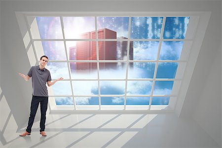 Man shrugging his shoulders against server towers seen through window Stock Photo - Budget Royalty-Free & Subscription, Code: 400-07448611