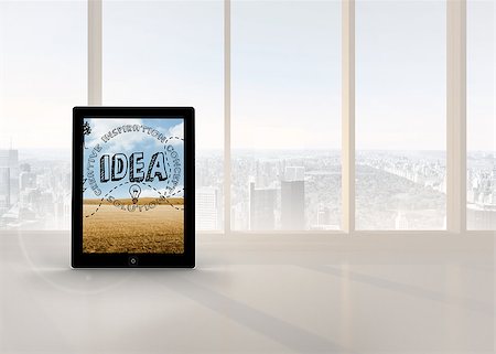 Idea graphic on tablet screen against bright white room with windows Stock Photo - Budget Royalty-Free & Subscription, Code: 400-07448804
